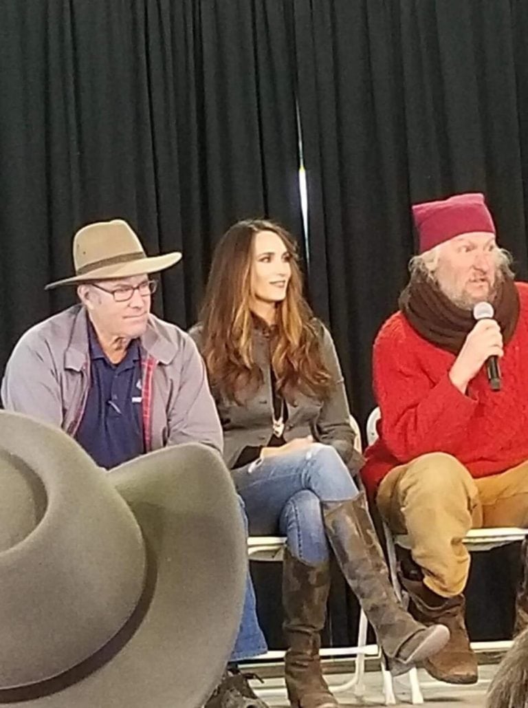 Stacy Lyn Harris seated between Joel Salatin and Eustace Conway on the Q&A panel at the 2018 Homesteaders of America Conference