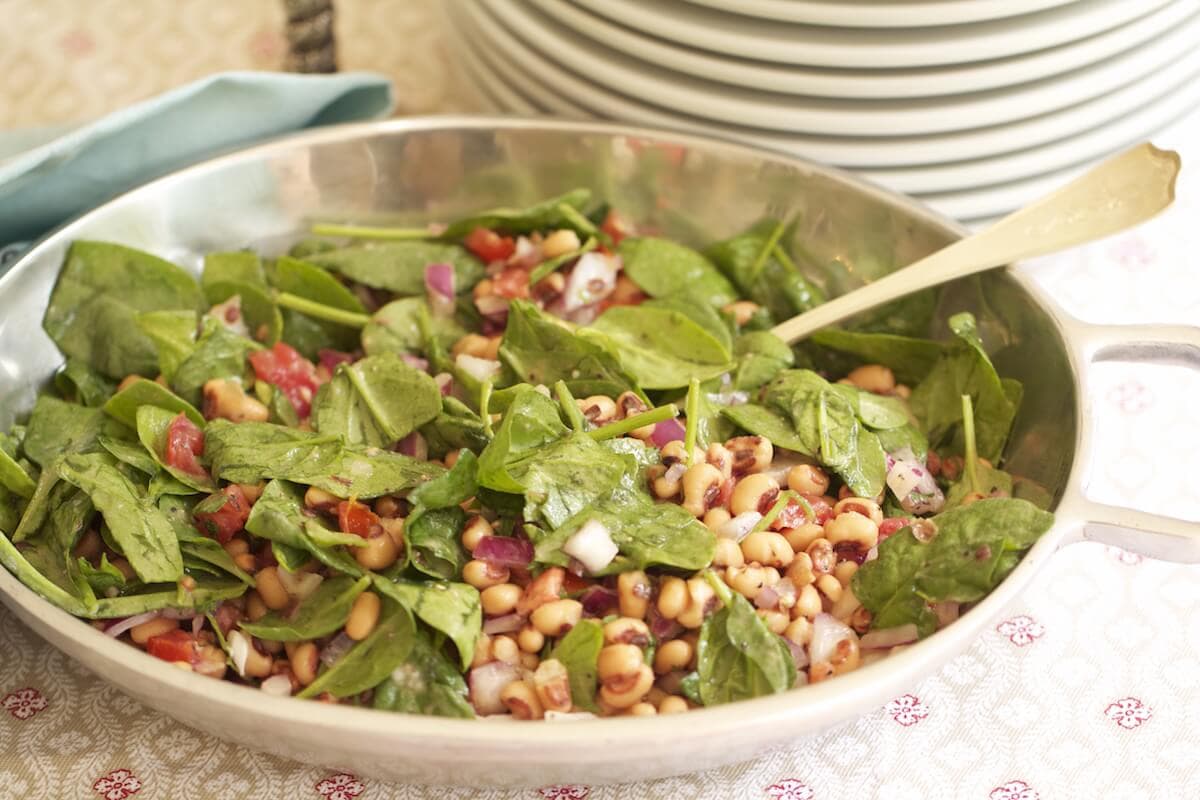 black-eyed pea salad with spinach served in bowl