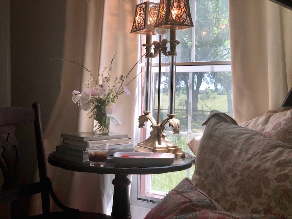 A picture of home decor and artwork in Stacy Lyn Harris's restful bedroom, from her blog on How to Create a Restful Bedroom