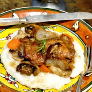 Picture of Chicken and Mushrooms over Cheesy Grits, recipe by Stacy Lyn Harris from her Harvest Cookbook