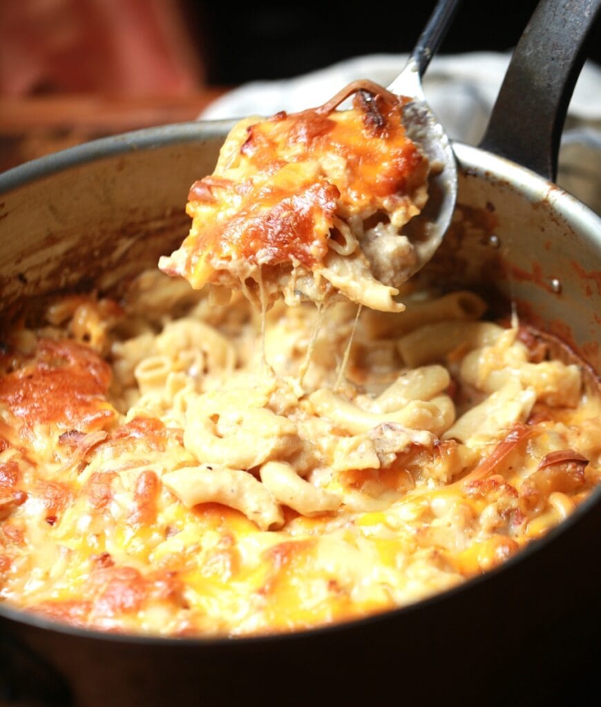 Copper pot of mac n cheese with crawdads