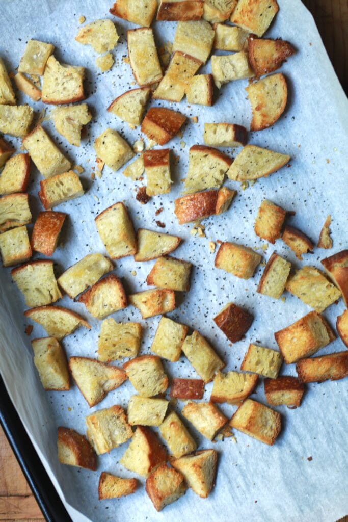 These homemade croutons emerge from the oven crunch and chewy.