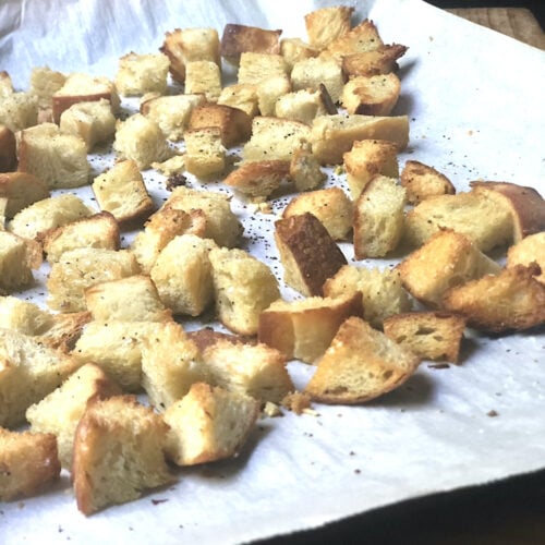 homemade croutons toasted on baking sheet