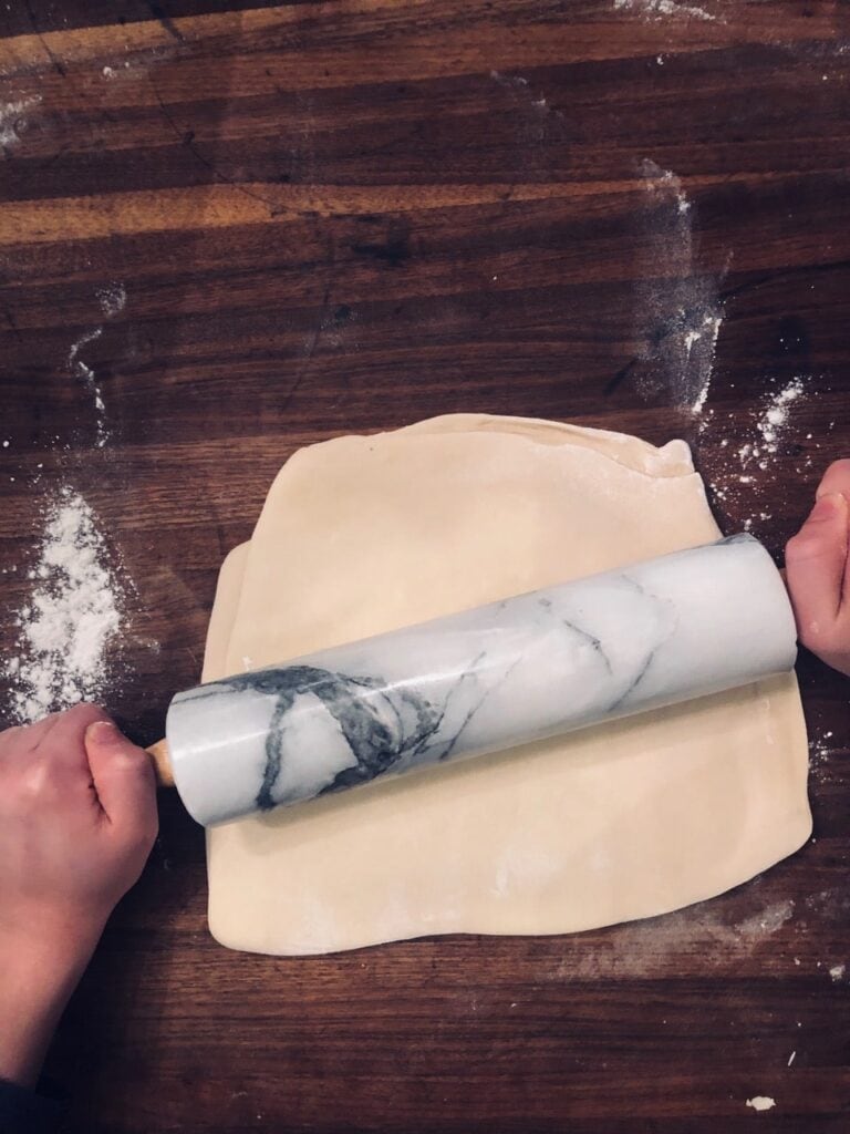 Roll the dough together, incorporating the layers of butter and dough.