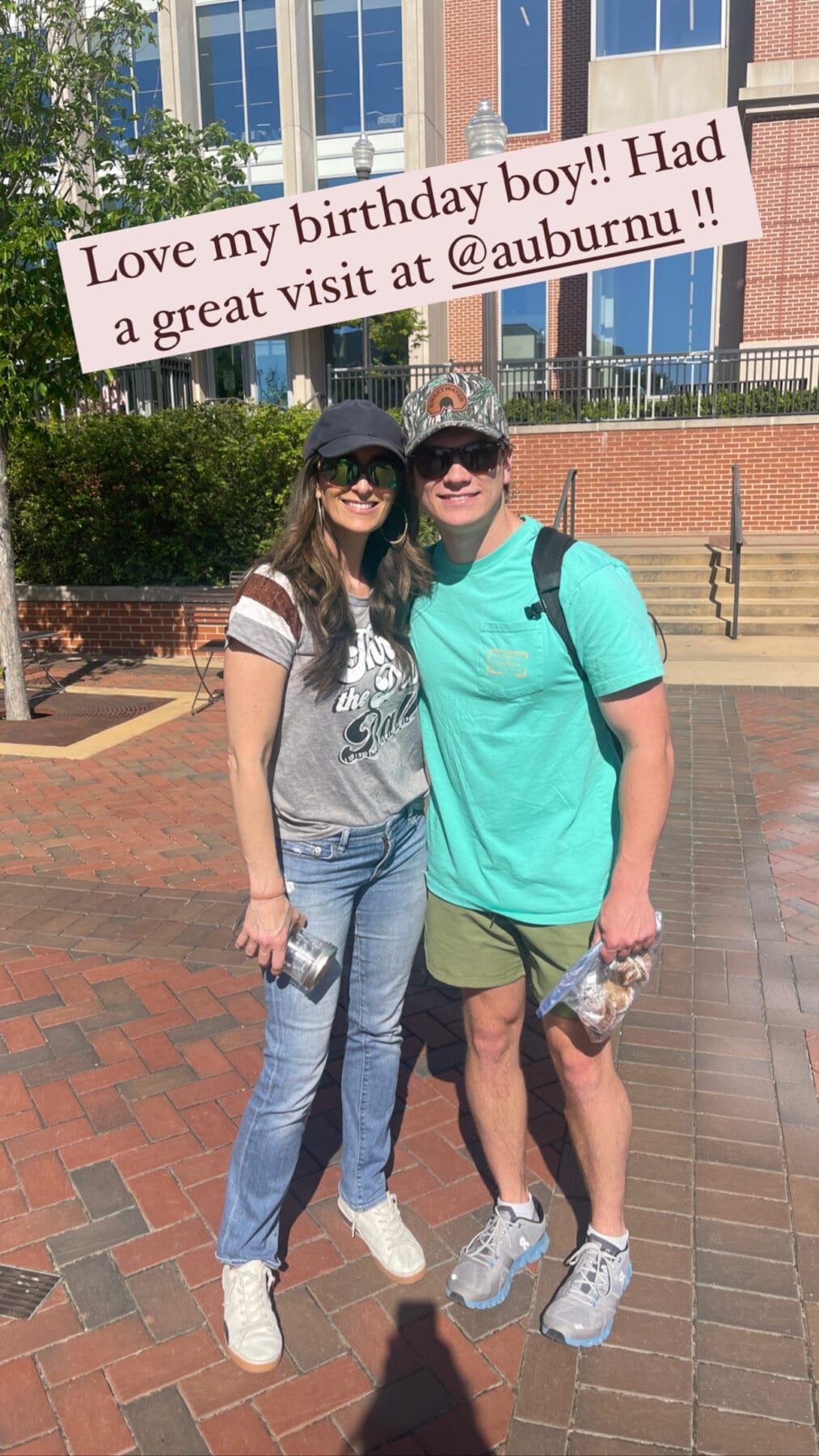 Stacy Lyn with son Howlett in front of Auburn University brick and glass building. Text: Love my birthday boy!! Had a great visit at @auburnu!!
